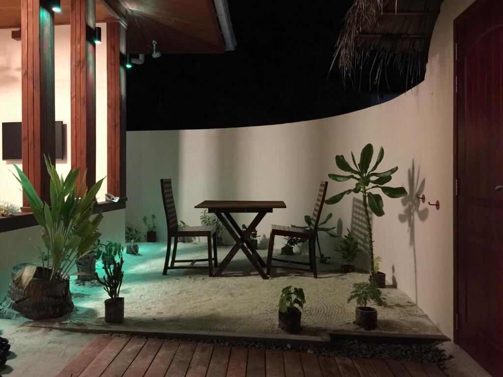 Outdoor seating area at Noomuraka Inn, Omadhoo, Maldives