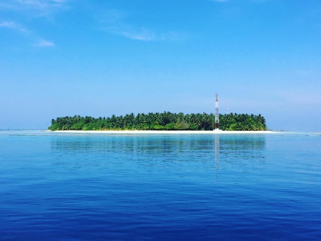 Omadhoo island seen from the ocean, Maldives